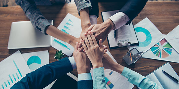Cropped top above high angle view of hands four stylish elegant classy business sharks gathering deal over table with papers documents work station place